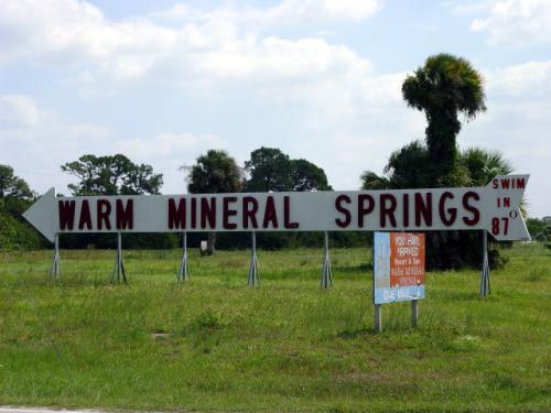Warm Mineral Springs Florida: Swim in 87-degrees Directional Sign at Warm Mineral Springs Motel in Warm Mineral Springs Florida on Round America 50-State Trip. Day 10 - 2003-04-10.